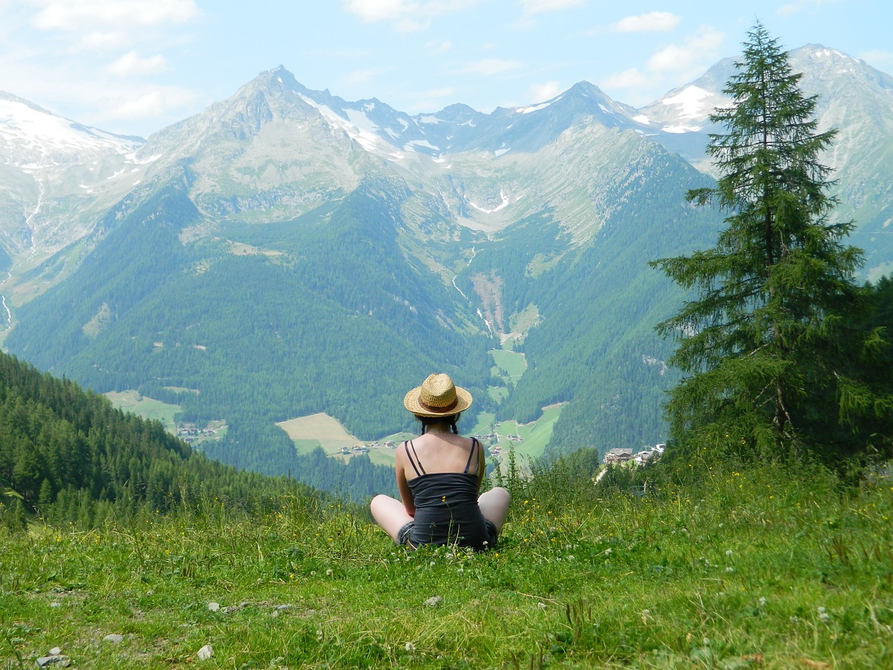 woman sitting staring at mountain