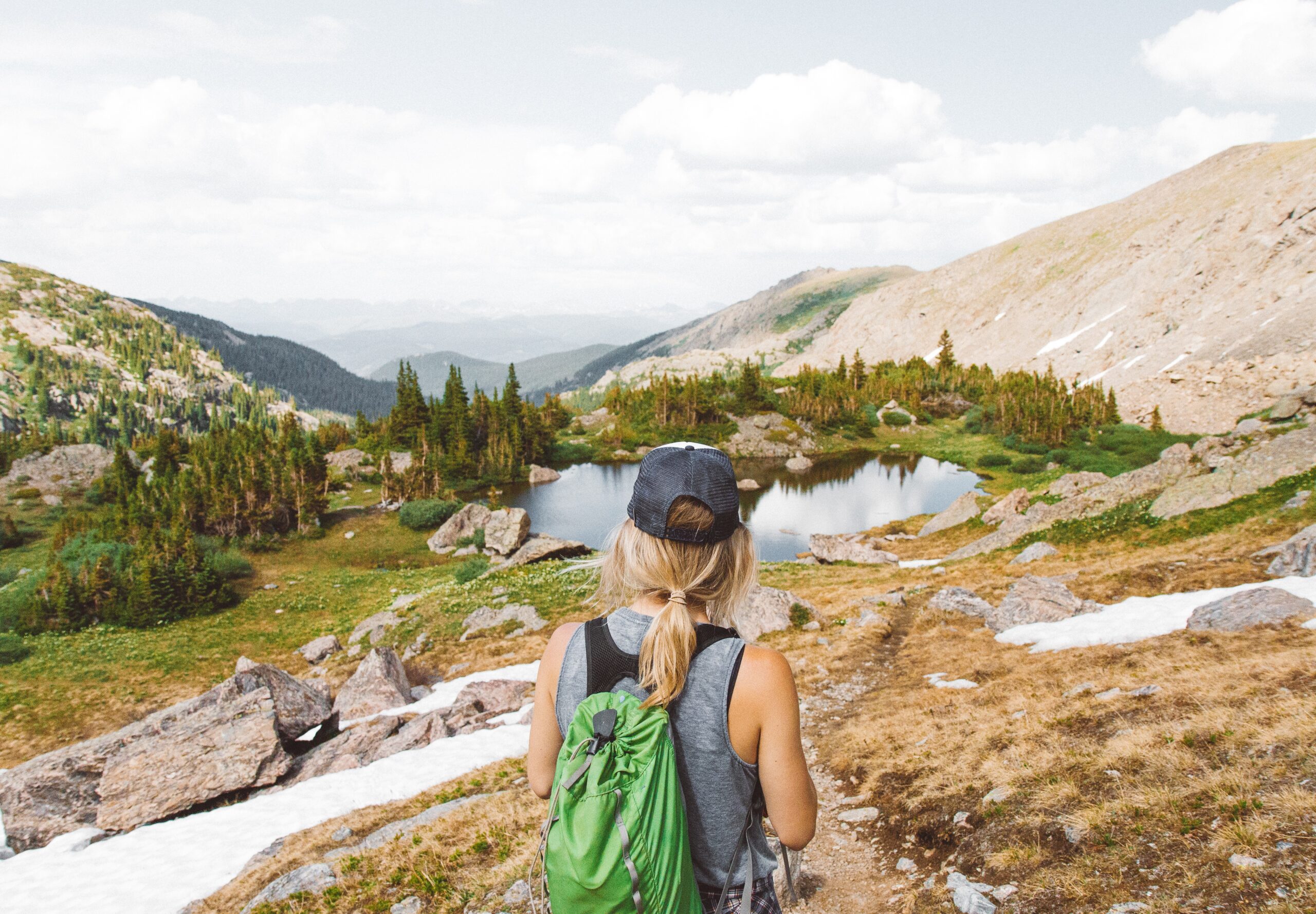 Woman looking out onto Rocky Mountains