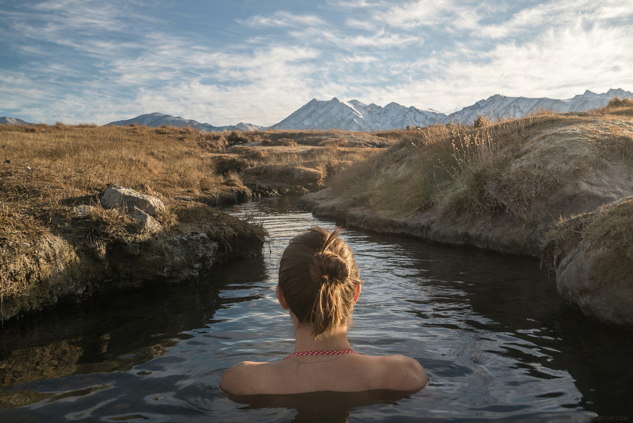 woman relaxing in hot spring pool